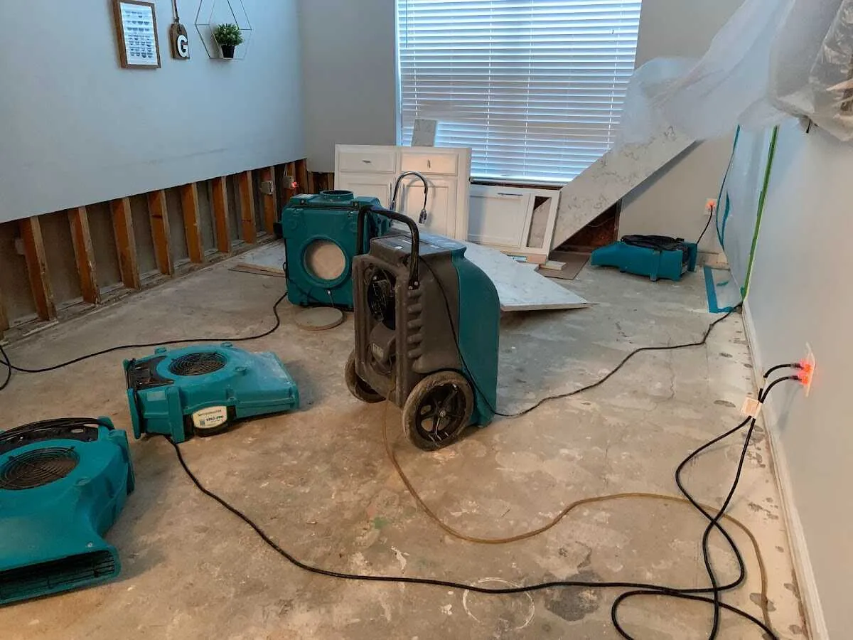 Dehumidifier in flood-cut room for Water Damage Restoration in Montebello